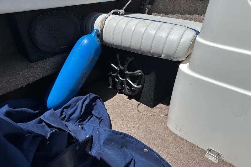 Slide: The Image of Interior of a 2002 Chaparral 205 SSe boat with blue fender and speaker. - 17