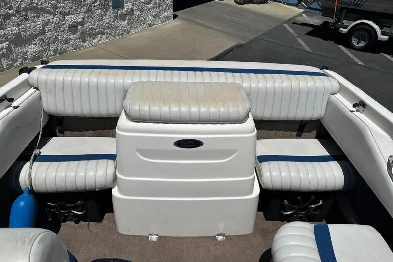 Slide: The Image of Interior of a 2002 Chaparral 205 SSe boat with white and blue seating. - 14