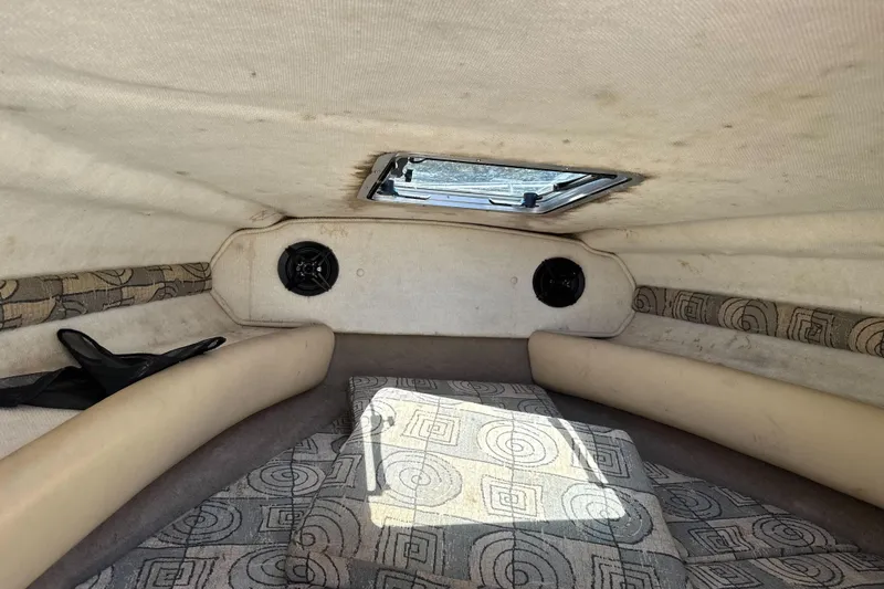 Slide: The Image of Interior cabin of a 2002 Chaparral 205 SSe boat with patterned upholstery. - 22
