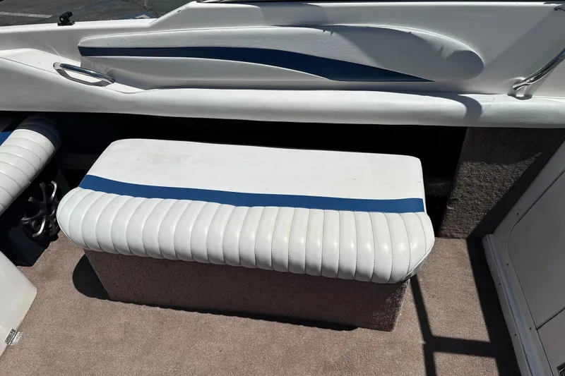 Slide: The Image of Interior seating of a 2002 Chaparral 205 SSe boat with white and blue upholstery. - 15