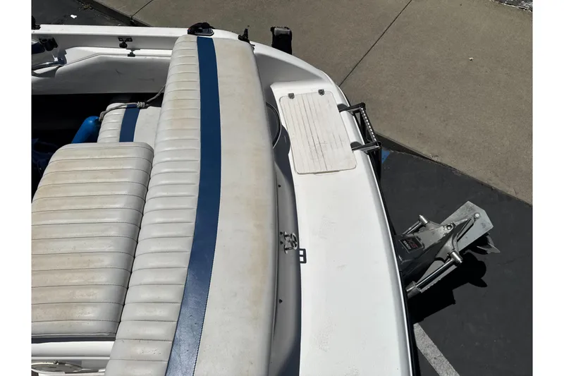Slide: The Image of 2002 Chaparral 205 SSe boat interior with blue-striped seating and swim platform. - 11