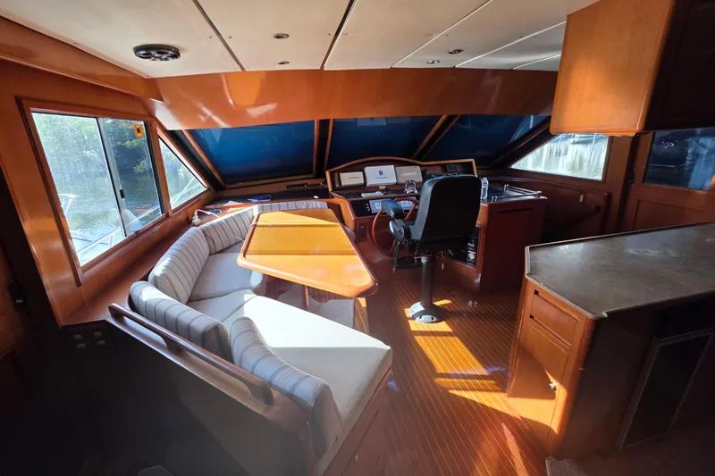 Slide: The Image of Pilothouse interior of 2000 Ocean Alexander 60 Trawler with seating and navigation area. - 15