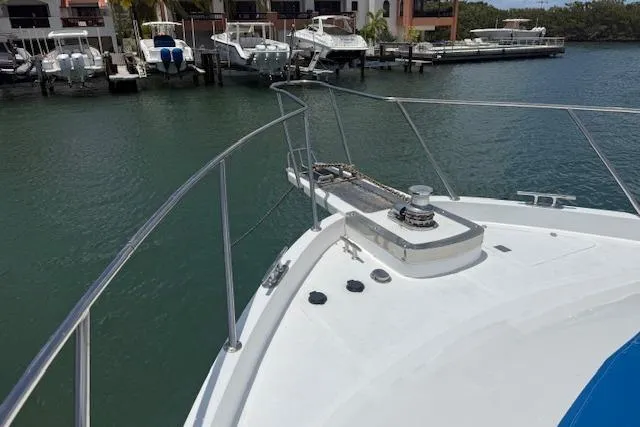 Slide: The Image of Bow view of 2000 Ocean Alexander 60 Trawler docked in marina. - 4
