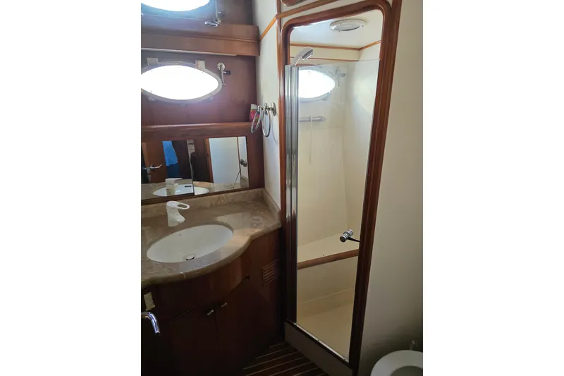 Slide: The Image of Bathroom interior of 2000 Ocean Alexander 60 Trawler with sink and shower. - 27