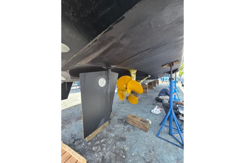 Slide: The Image of Underwater view of 2000 Ocean Alexander 60 Trawler's propeller and rudder during maintenance. - 32