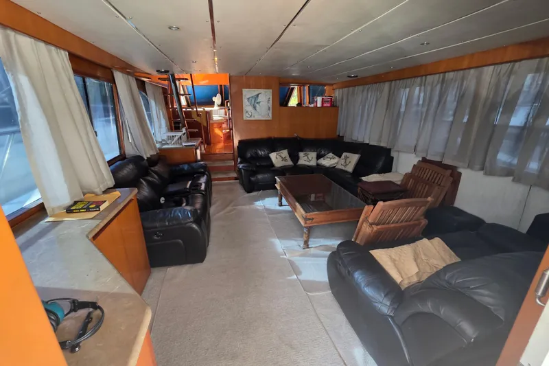 Slide: The Image of Luxurious interior of 2000 Ocean Alexander 60 Trawler with leather seating and wooden accents. - 11