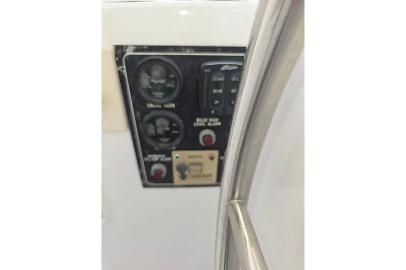 Slide: The Image of Control panel on a 2000 Ocean Alexander 60 Trawler yacht, featuring gauges and switches. - 7