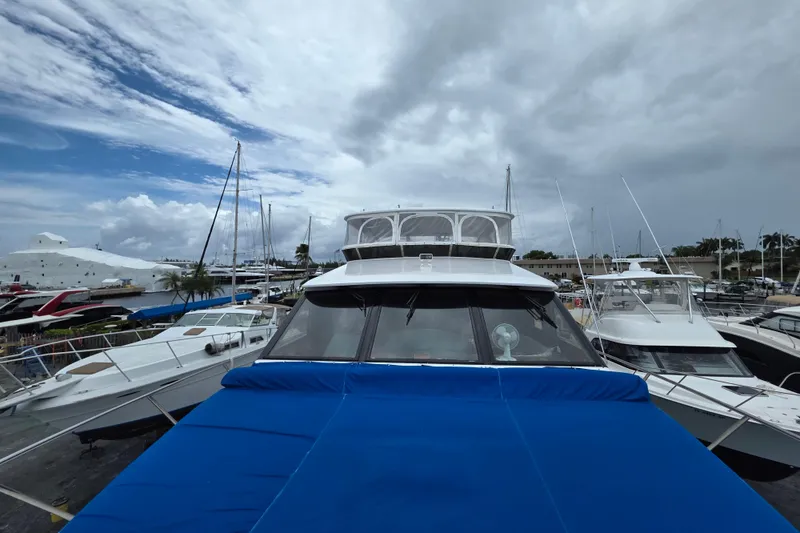 Slide: The Image of Ocean Alexander 60 Trawler 2000 docked at marina under cloudy sky. - 5
