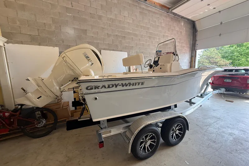 Slide: The Image of 2025 Grady-White Fisherman 180 boat on trailer in garage setting. - 3