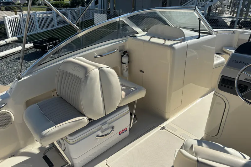 Slide: The Image of 2004 Scout 222 Dorado boat interior with seating and navigation equipment. - 10