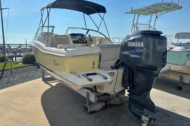 Slide: The Image of 2004 Scout 222 Dorado boat with Yamaha outboard motor on display. - 2