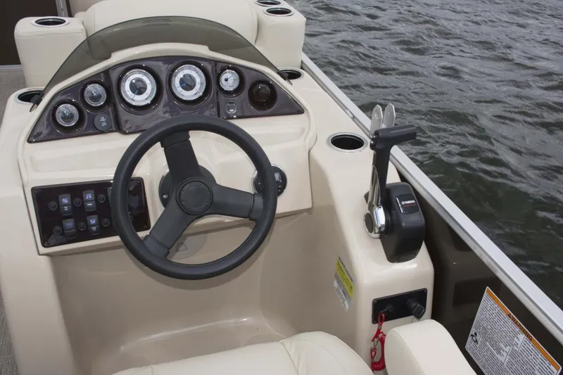 Slide: The Image of Manufacturer Provided Image: 2018 Sylvan Mirage 820 Cruise boat dashboard and steering wheel on water. - 3