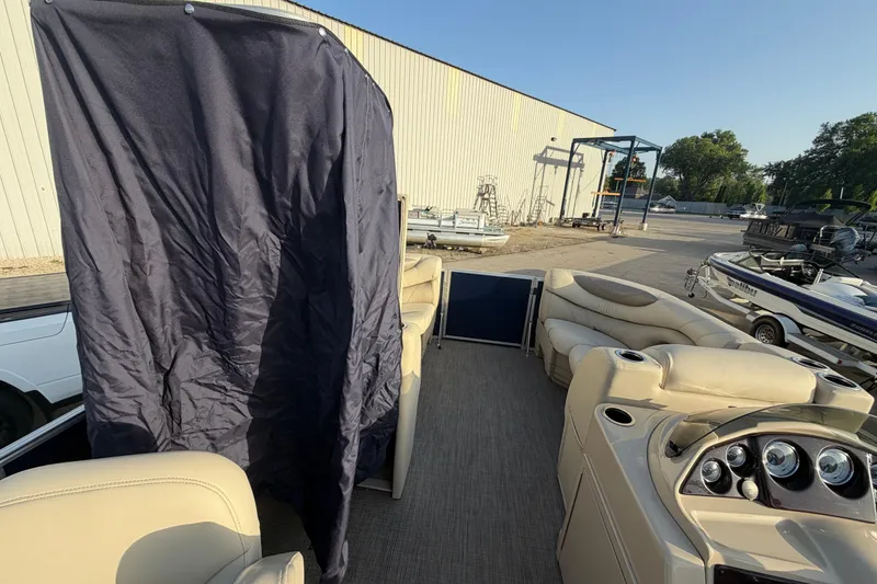 Slide: The Image of 2018 Sylvan Mirage 820 Cruise pontoon boat interior with seating and control panel. - 20