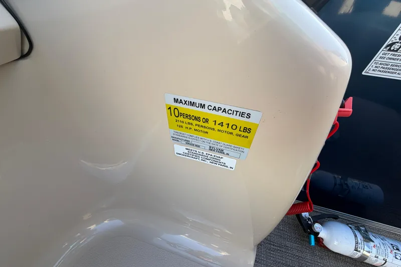 Slide: The Image of 2018 Sylvan Mirage 820 Cruise capacity label, maximum 10 persons or 1410 lbs. - 19