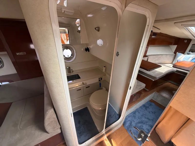 Slide: The Image of Interior view of a 2010 Sea Ray Sundancer 310 featuring a bathroom and living area. - 40