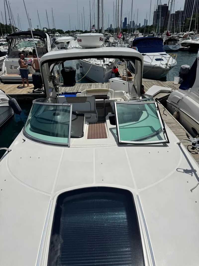 Slide: The Image of A 2010 Sea Ray Sundancer 310 docked in a busy marina. - 18