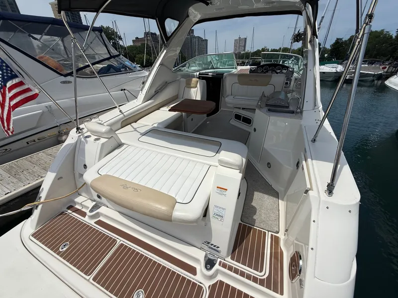 Slide: The Image of The image shows the cockpit of a 2010 Sea Ray Sundancer 310 with beige and white interior. - 7