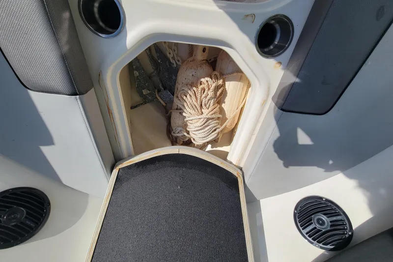 Slide: The Image of 2023 Bayliner VR6 Bowrider OB storage compartment with rope and anchor. - 30