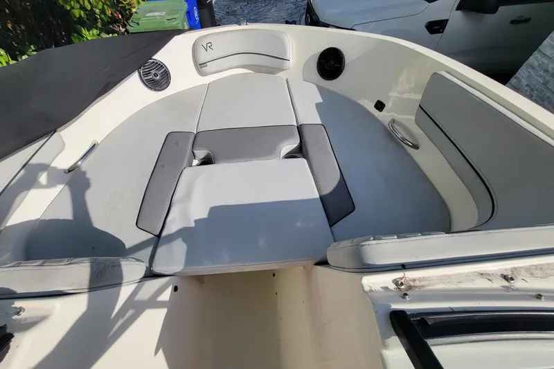 Slide: The Image of 2023 Bayliner VR6 Bowrider OB interior with cushioned seating and sleek design. - 32