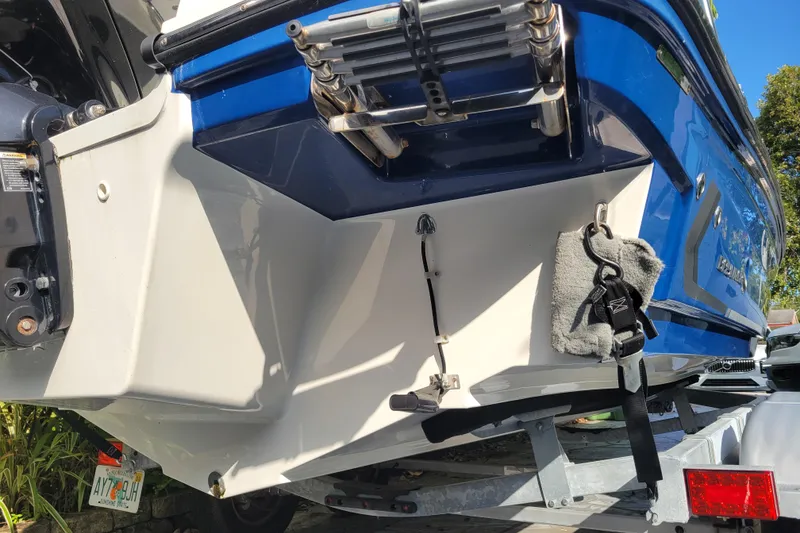 Slide: The Image of 2023 Bayliner VR6 Bowrider OB boat on trailer, rear view with ladder and accessories. - 9