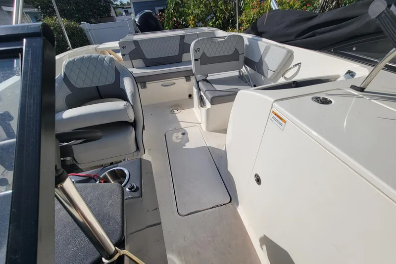 Slide: The Image of 2023 Bayliner VR6 Bowrider OB interior with gray seating and modern design. - 27