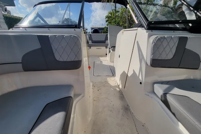 Slide: The Image of 2023 Bayliner VR6 Bowrider OB interior with gray seating and open deck layout. - 31