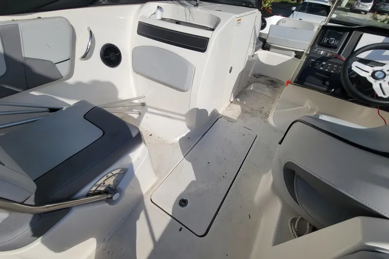 Slide: The Image of 2023 Bayliner VR6 Bowrider OB interior with seating and steering wheel. - 20