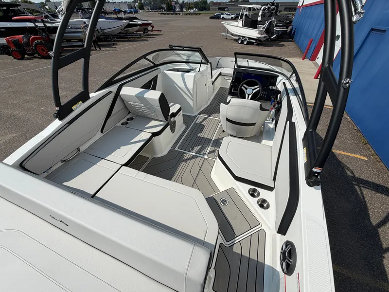 Slide: The Image of The image shows the cockpit of a 2027 Sea Ray SPX 210 with modern seating and steering wheel. - 8