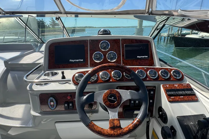 Slide: The Image of Cockpit of 2004 Formula 37 Performance Cruiser with Raymarine navigation system and wood-accented dashboard. - 15