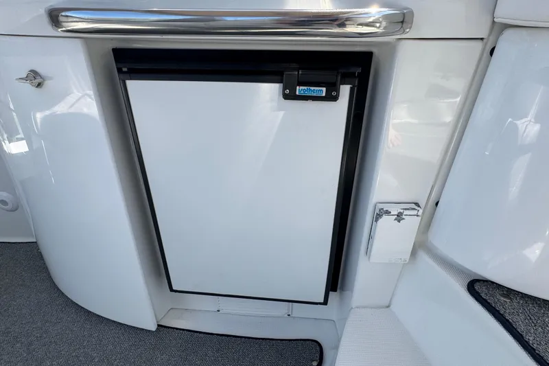 Slide: The Image of Compact refrigerator on a 2004 Formula 37 Performance Cruiser yacht, featuring sleek white design. - 11