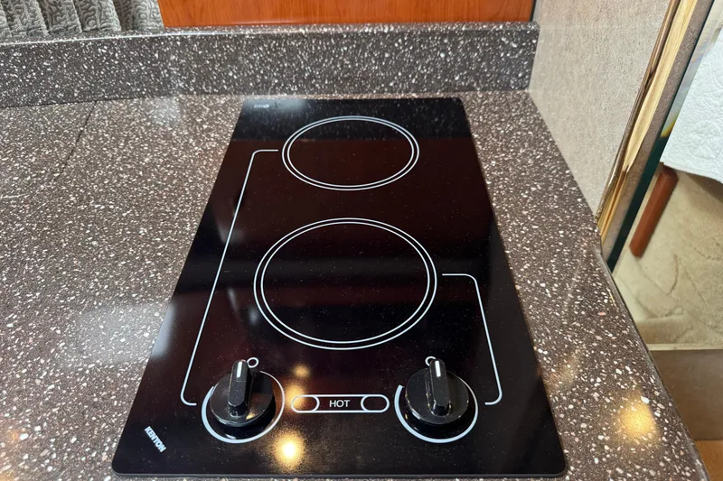 Slide: The Image of Ceramic cooktop on 2004 Formula 37 Performance Cruiser, featuring two burners and sleek design. - 22