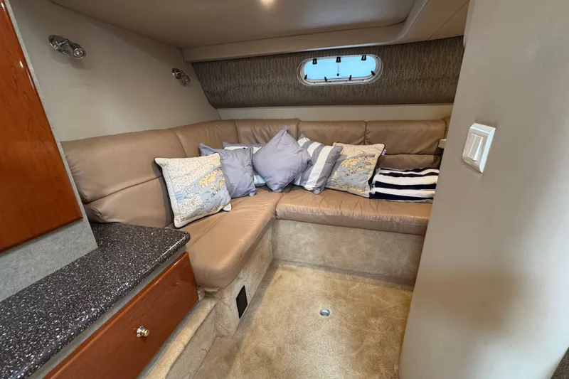 Slide: The Image of Interior of 2004 Formula 37 Performance Cruiser with beige seating and decorative pillows. - 25