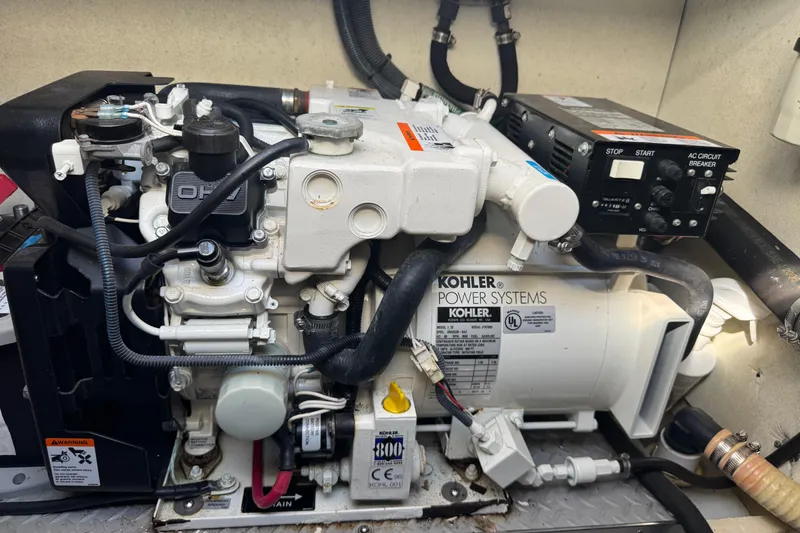 Slide: The Image of Engine compartment of a 2004 Formula 37 Performance Cruiser with Kohler power system. - 33