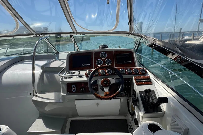 Slide: The Image of Cockpit of 2004 Formula 37 Performance Cruiser with steering wheel and navigation instruments. - 14