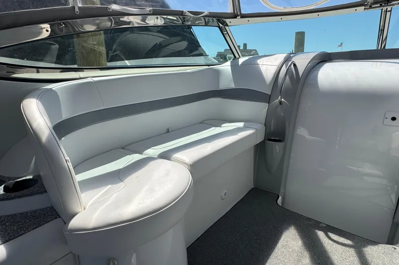 Slide: The Image of 2004 Formula 37 Performance Cruiser interior with sleek white seating and modern design. - 12