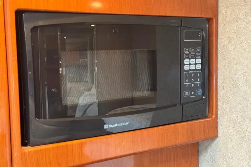 Slide: The Image of Built-in microwave in 2004 Formula 37 Performance Cruiser kitchen area. - 23