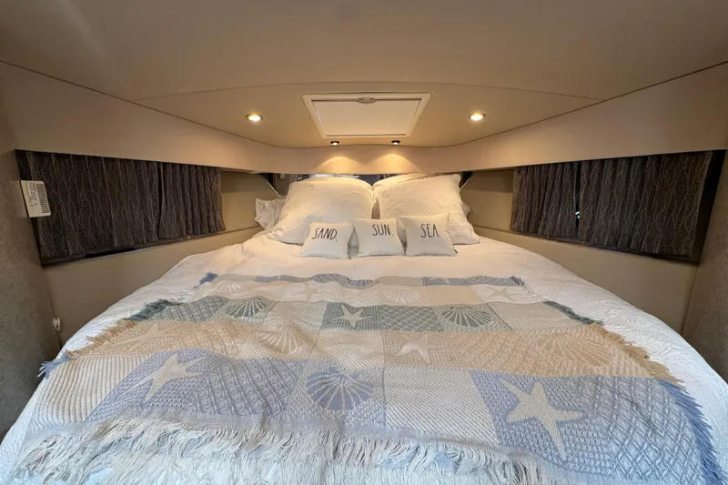 Slide: The Image of Luxurious cabin interior of 2004 Formula 37 Performance Cruiser with cozy bedding. - 28