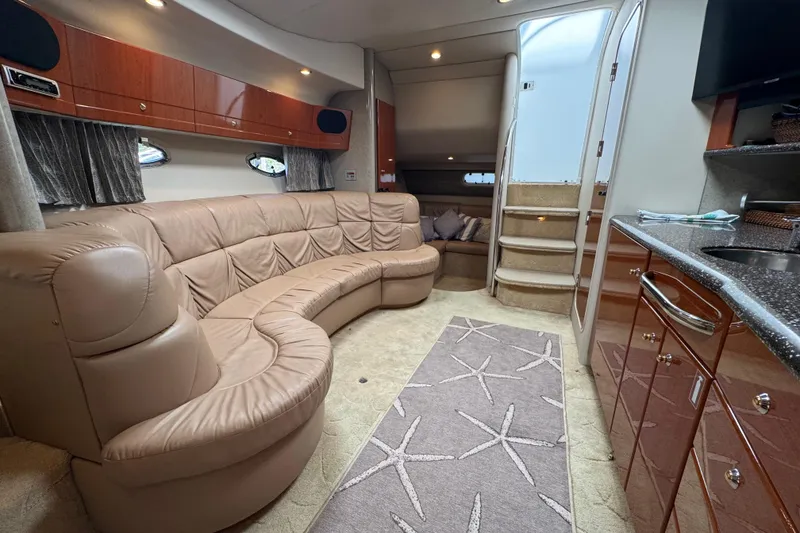 Slide: The Image of Interior of a 2004 Formula 37 Performance Cruiser with plush seating and modern amenities. - 16