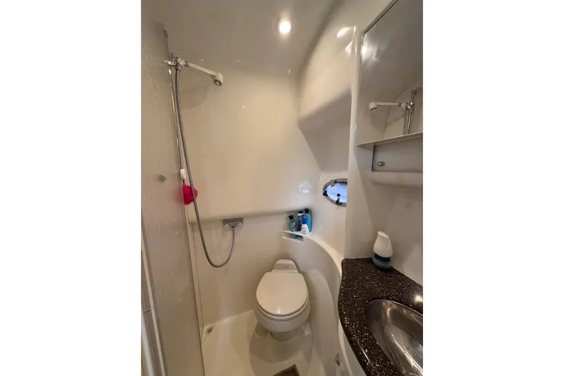 Slide: The Image of 2004 Formula 37 Performance Cruiser bathroom with shower, toilet, and sink. - 29