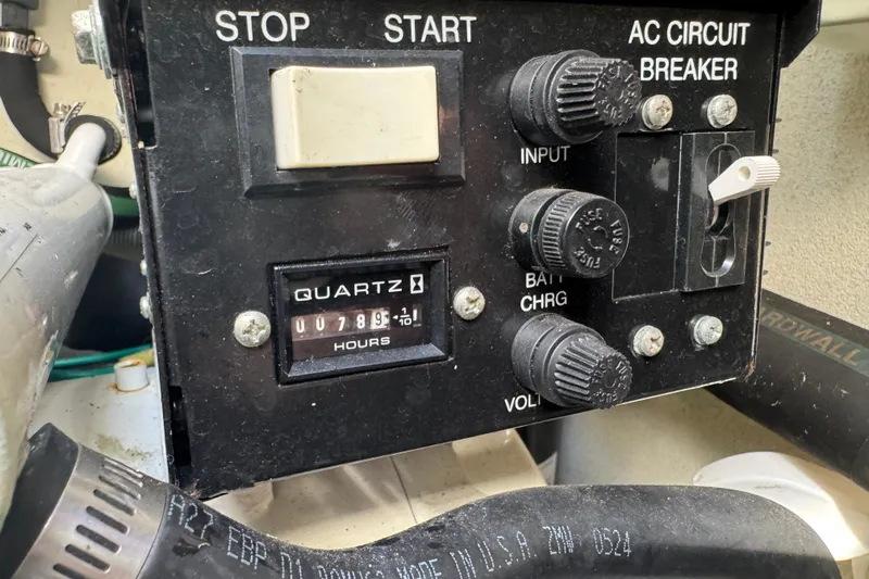 Slide: The Image of Control panel of a 2004 Formula 37 Performance Cruiser with hour meter and circuit breaker. - 32
