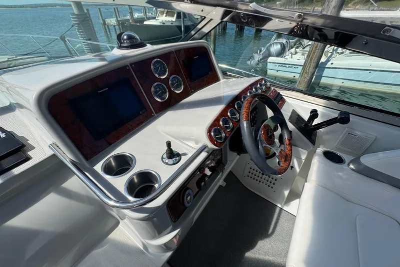 Slide: The Image of Cockpit of 2004 Formula 37 Performance Cruiser with modern controls and steering wheel. - 34