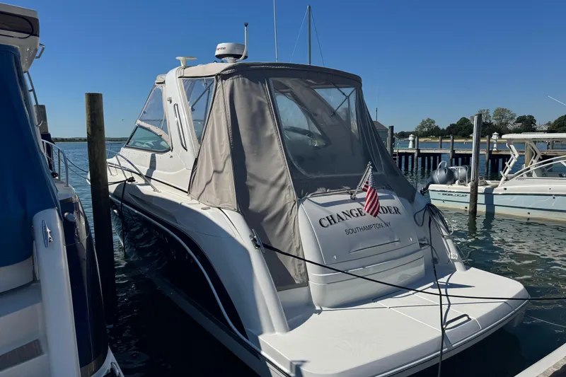 Slide: The Image of 2004 Formula 37 Performance Cruiser docked in sunny marina, featuring covered cockpit. - 5