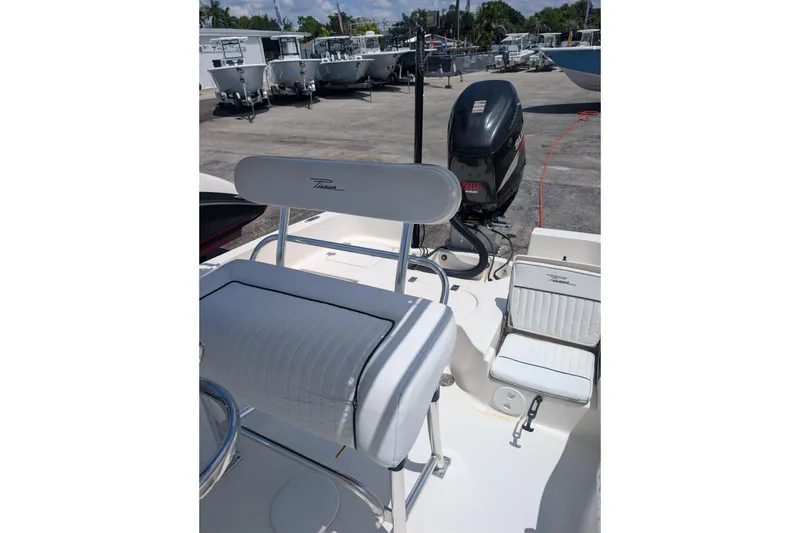 Slide: The Image of 2009 Pioneer 220 Bay Sport boat interior with seating and outboard motor. - 5
