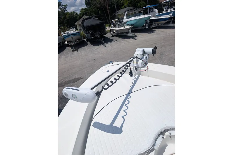 Slide: The Image of 2009 Pioneer 220 Bay Sport boat with trolling motor in a marina. - 9