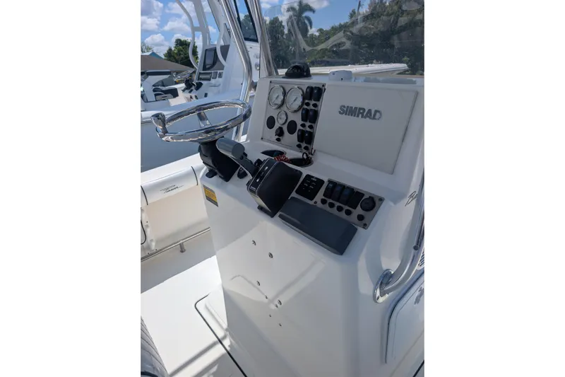 Slide: The Image of 2009 Pioneer 220 Bay Sport boat console with Simrad navigation system. - 4