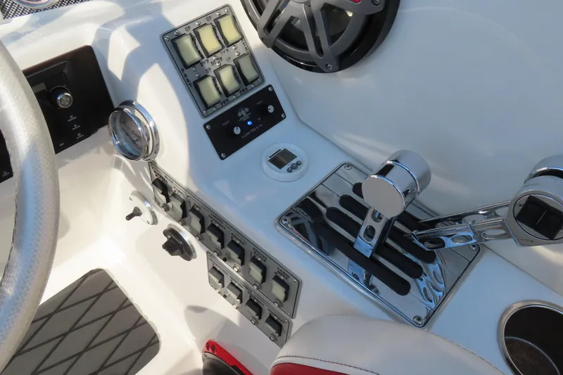 Slide: The Image of Control panel of a 2013 Nordic 39 POKER RUN boat with switches and throttle levers. - 25