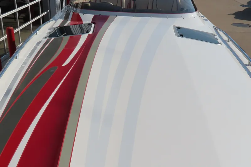 Slide: The Image of 2013 Nordic 39 Poker Run boat with sleek red and white design on deck. - 5