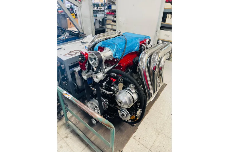 Slide: The Image of High-performance engine of a 2013 Nordic 39 POKER RUN boat in a workshop setting. - 35