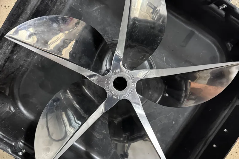 Slide: The Image of Shiny metal propeller for 2013 Nordic 39 POKER RUN boat, displayed on black surface. - 11