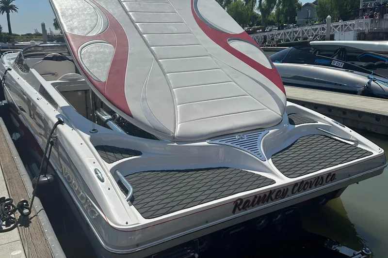 Slide: The Image of 2013 Nordic 39 Poker Run boat docked, featuring sleek design and custom upholstery. - 16